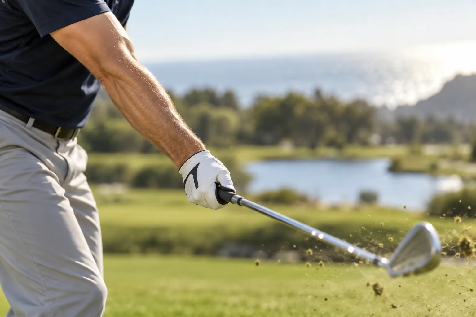 Create a cinematic close-up of a right-handed golfer’s lead arm and golf club during a pitching motion, showing the forearm angled naturally and the c...